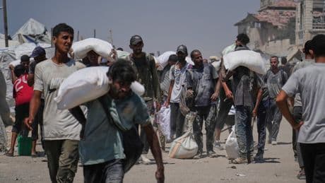 Israeli strikes kill at least 34 people in Gaza, officials say, as some aid restrictions are eased