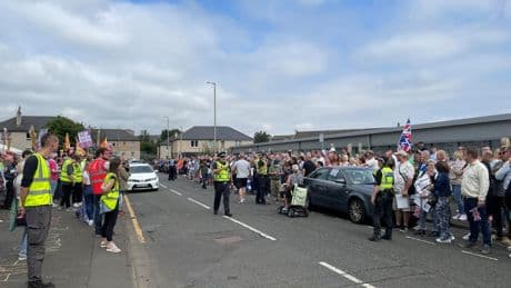 Anti-racism demonstrators stage counter-protest outside asylum seekers hotel