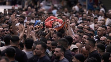Israeli gunfire heard as crowds of Palestinians try to reach an aid center in Gaza