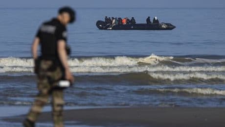 Moment French police completely fail to stop migrant boat and just take pictures