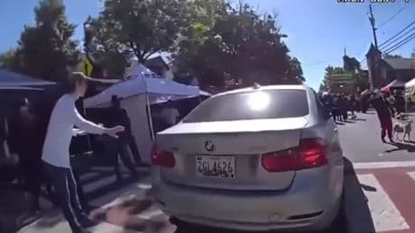 Watch: Woman tries to drive through street festival to get to work