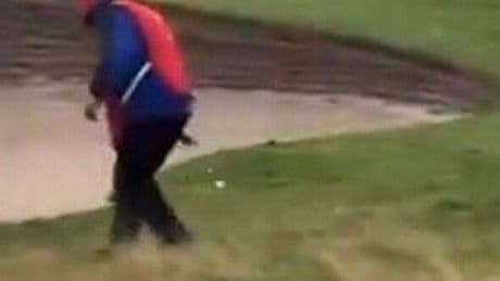 Donald Trump 'caught cheating' at his Scottish resort as caddie moves ball for him