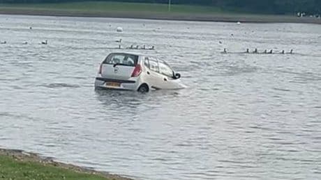 WATCH how one man's car sinking into loch takes 'you can't park there' to new depths