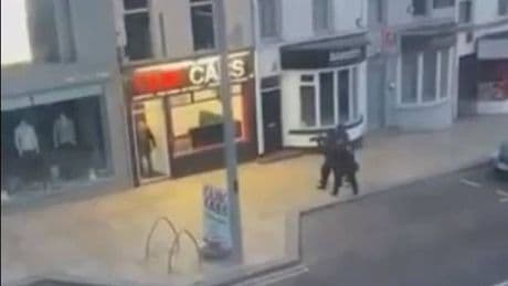 Man detained by armed police after multiple shots fired on UK high street