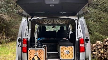 Transform any van into tiny home on wheels with BARGAIN conversion kit that includes kitchen, double bed & work desk