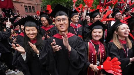 AP PHOTOS: Harvard students celebrate graduating amid a legal battle with the White House