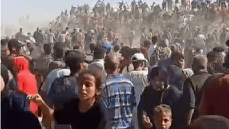 Moment thousands of desperate Gazans overrun US-backed aid site hours after it opens as ‘shots fired to disperse crowd’