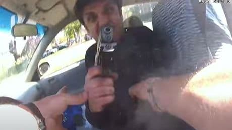 Terrifying bodycam shows moment driver pulls gun & shoots cops at point-blank range after ranting about the Taliban