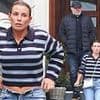 Coleen Rooney shows off her figure as she unbuttons her blue jeans after leaving a curry restaurant with husband Wayne
