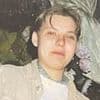 Woman is charged with murder after Polish mother's body was found buried in garden 15 years after she vanished