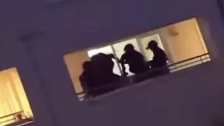 Armed cops storm Irvine flat as officers use 'stun grenades' in operation