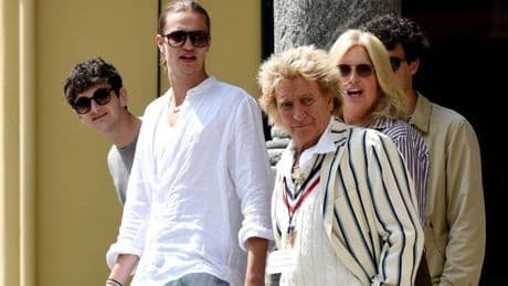 Sir Rod Stewart dwarfed by teenage son as he is forced to rest his voice on 'farewell' tour