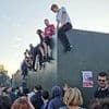 'You're my Wonderwall!': Oasis fans ignore security and climb barrier to try and see band play gig at Heaton Park