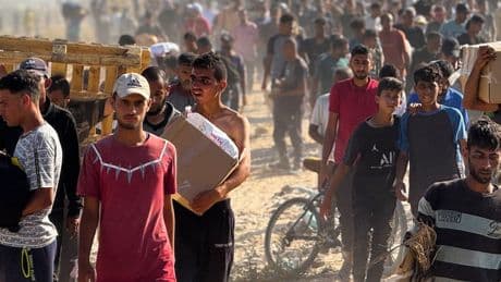 Chaos erupts after thousands of Palestinians rush to grab aid in Gaza