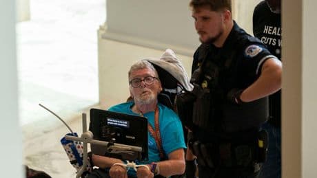Protesters in wheelchairs cuffed with zip-ties during Capitol demonstrations against Medicaid cuts