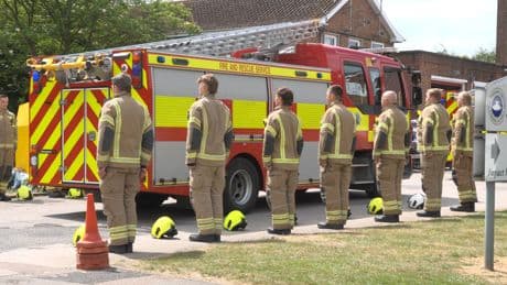 Firefighters form guard of honour after two colleagues and business owner die in fire