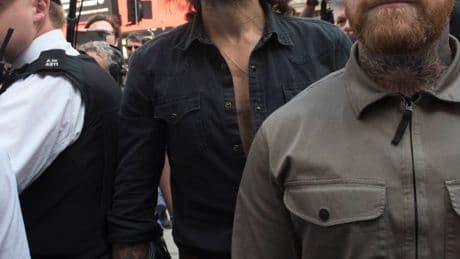 Russell Brand guarded by boxer pal of Tyson Fury as he appeared in court on rape and sex assault charges