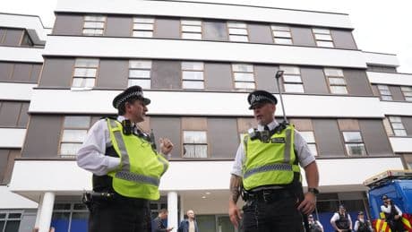 How many asylum seekers are in UK hotels and why are they being housed there?