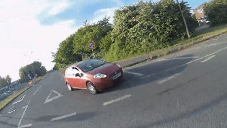 Moment cyclist is hit by car at roundabout sending him crashing to the floor – but who’s in the wrong?