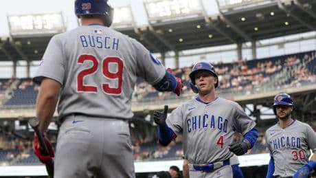 Happ homers, has four RBIs on three hits as Cubs down Nationals