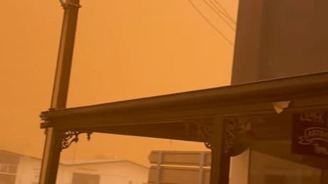 Hazardous dust storm turns sky eerie orange as residents urged to ‘stay inside’