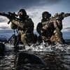 Royal Marines training could be watered down to let more women into the Navy following 'political pressure' over diversity targets