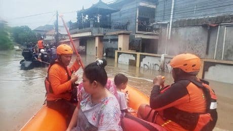 Flash floods in Indonesia leave at least 11 dead and 13 missing