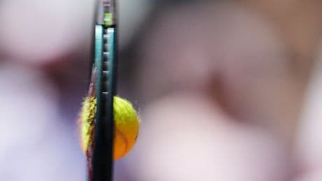 AP PHOTOS: Tattoos, clay and bouncing hair bring the French Open to life