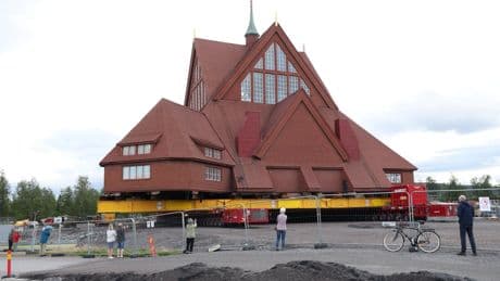 How do you move a beloved Swedish church three miles up the road? With prayer, engineering and a special trailer