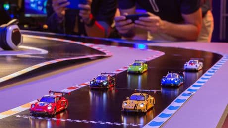 A veteran toy racing company is trading slots for smartphone-controlled RC cars