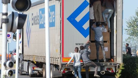 Foreign lorry drivers forced to plaster vans with signs to deter migrants trying to sneak into soft touch Britain