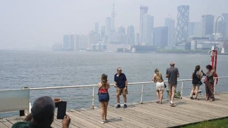 Canadians face air quality, heat warnings as some stuck indoors from both
