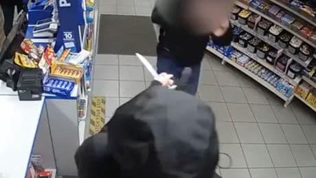 Shop worker confronts knife-wielding robber with bare hands after female colleague threatened