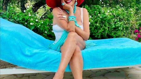Joan Collins, 92, stuns in white swimsuit as she poses poolside on European vacation