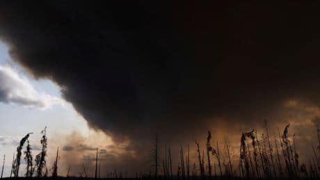 Wildfires burning across central Canada force additional evacuation orders and more shelters to open