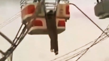 Woman screams 'I'm going to die' as she dangles above 100ft drop on ferris wheel