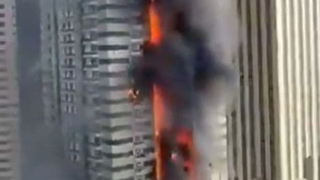 Massive fire rips through Dubai Marina skyscraper as thousands flee homes