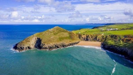 Eco campsite by beach with countryside views and tiny cabin selling toasties