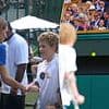 Kate's wave of solidarity: Princess of Wales shares poignant moment with young cancer patient, 11, at Wimbledon final