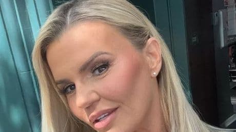 Kerry Katona sings Atomic Kitten hit on stage with famous boyband
