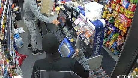 Terrifying moment masked man 'robs Scots store with meat cleaver'