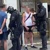 Moment armed police and force helicopter swoop on young men caught playing with water pistols outside Wetherspoons