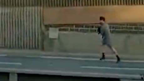 Watch: Dramatic moment police chase suspect down dual carriageway on foot