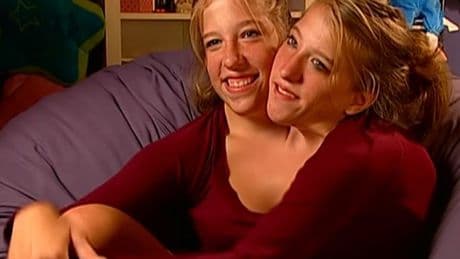 Conjoined sisters Abby and Brittany Hensel spotted carrying newborn baby
