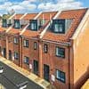 The village at war over £300K townhouses for asylum seekers: Furious residents 'were kept in the dark about new arrivals' and fear homes were purposely built for migrants