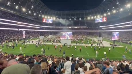 Wild moment Spurs fans storm pitch in huge invasion of Tottenham Stadium after lifting silverware in Bilbao