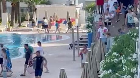 Watch determined tourists wear sprint shoes & even STRETCH before dawn dash for Magaluf pool spot…having queued for 1hr