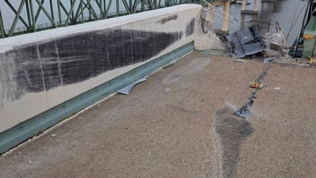 Truck smashes through barrier and plunges off a bridge into the Delaware River