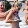 Kate Moss, 51, gets the giggles as she's surrounded by naked sunbathers on nudist beach in Ibiza - before nearly baring all herself!