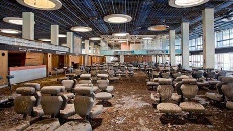 Inside abandoned European airport left to rot with chairs covered in faeces